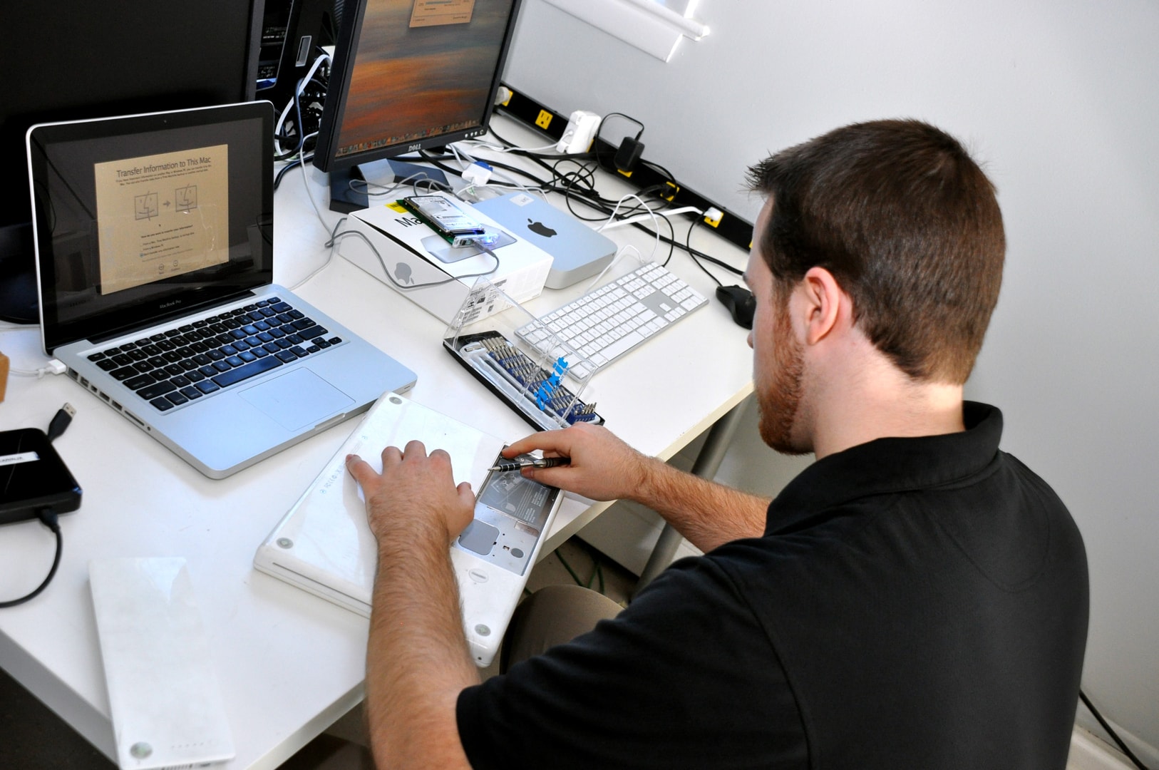 Professional computer repair technician in Montreal working on laptop repair
